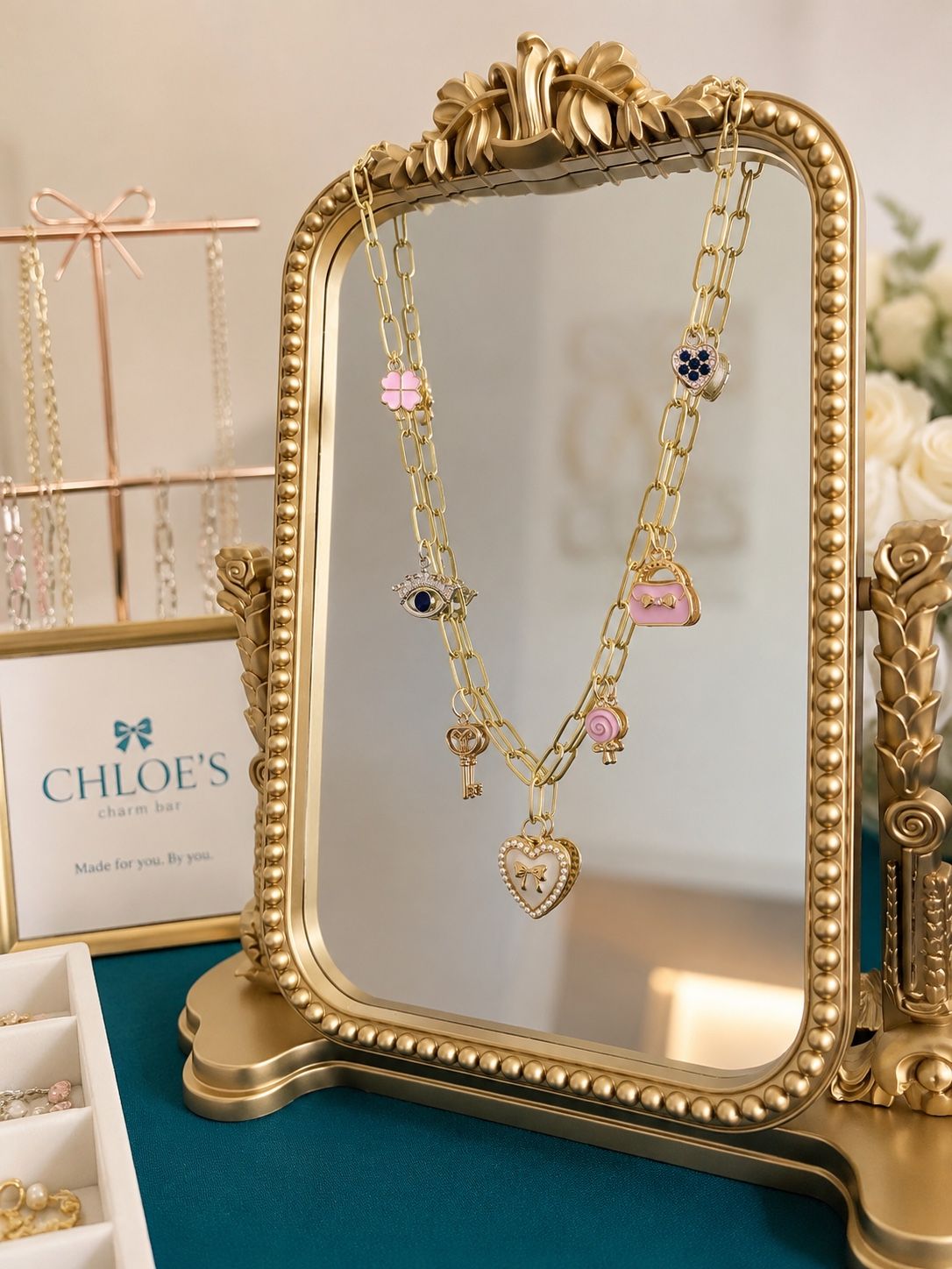 Elegant necklace displayed on a gold mirror